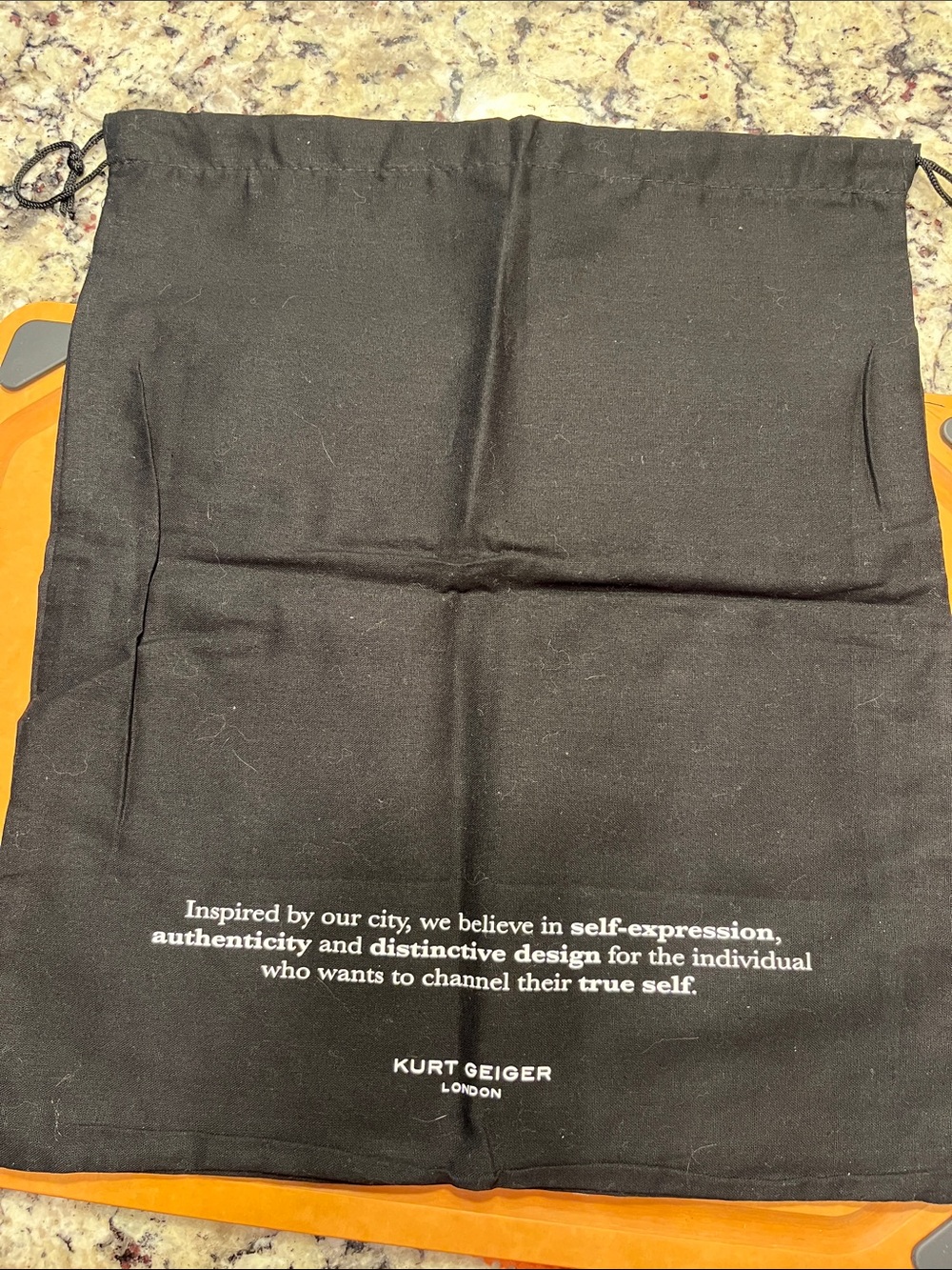Kurt Geiger Black Drawstring Bag with White Slogan - Picture 2 of 6